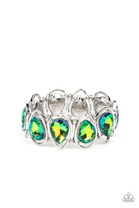 The Sparkle Society Multi Bracelet - September 2022 LOP oversized teardrop gems, coated in a shimmery green refracted shimmer are seemingly suspended inside silver teardrop frames. The airy borders allow the faceted edges of the teardrop beads to take center stage, as the frames, separated by tiny silver beads, wrap around the wrist on stretchy bands. Due to its prismatic palette, color may vary.