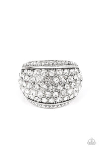 A thick band of silver arcs across the top of the finger, creating an exaggerated rounded frame. Countless tiny white rhinestones scatter across the surface, as straight lines of even more rhinestones line the outer edges in a blinding finish. Features a stretchy band for a flexible fit.